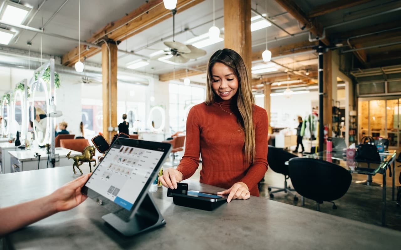 Customer paying by card at a retail checkout
