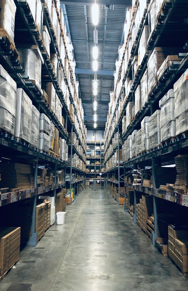 Fulfilment warehouse aisle stacked with inventory