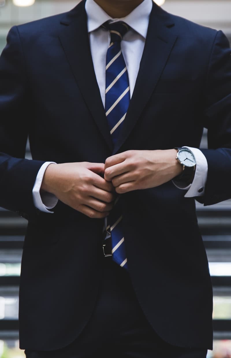 Executive in a suit adjusting his jacket