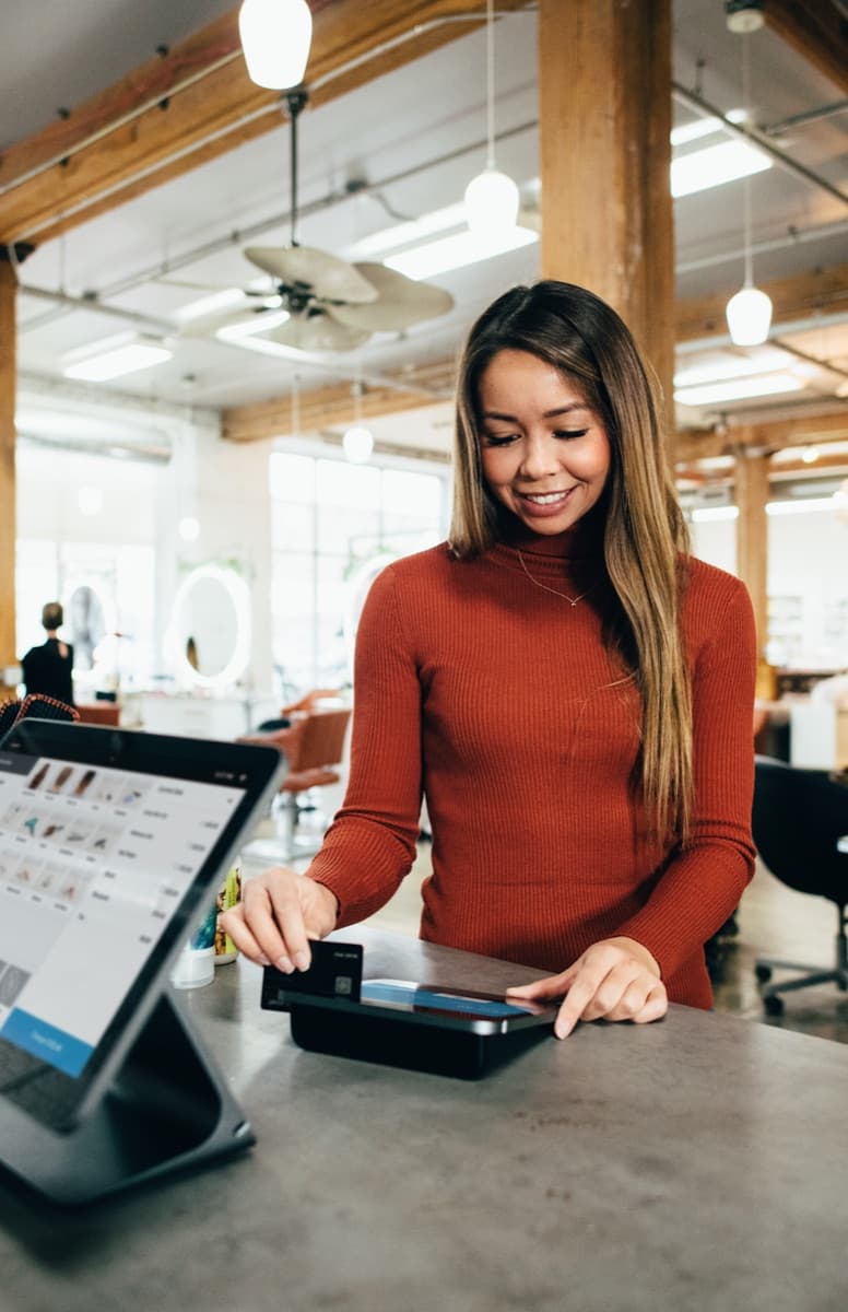 Customer paying by card on a countertop terminal