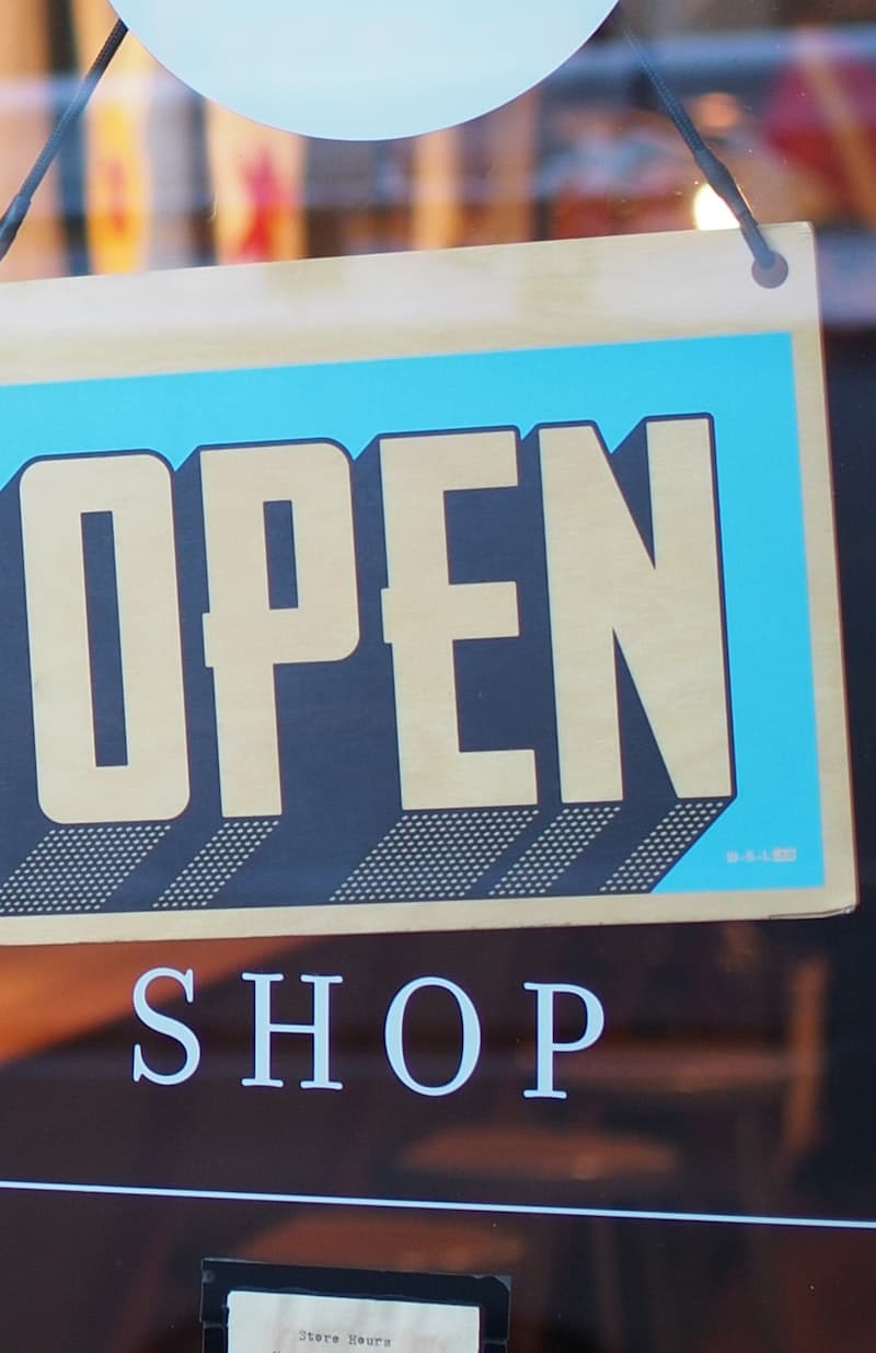 Open sign on a marketplace seller shop door