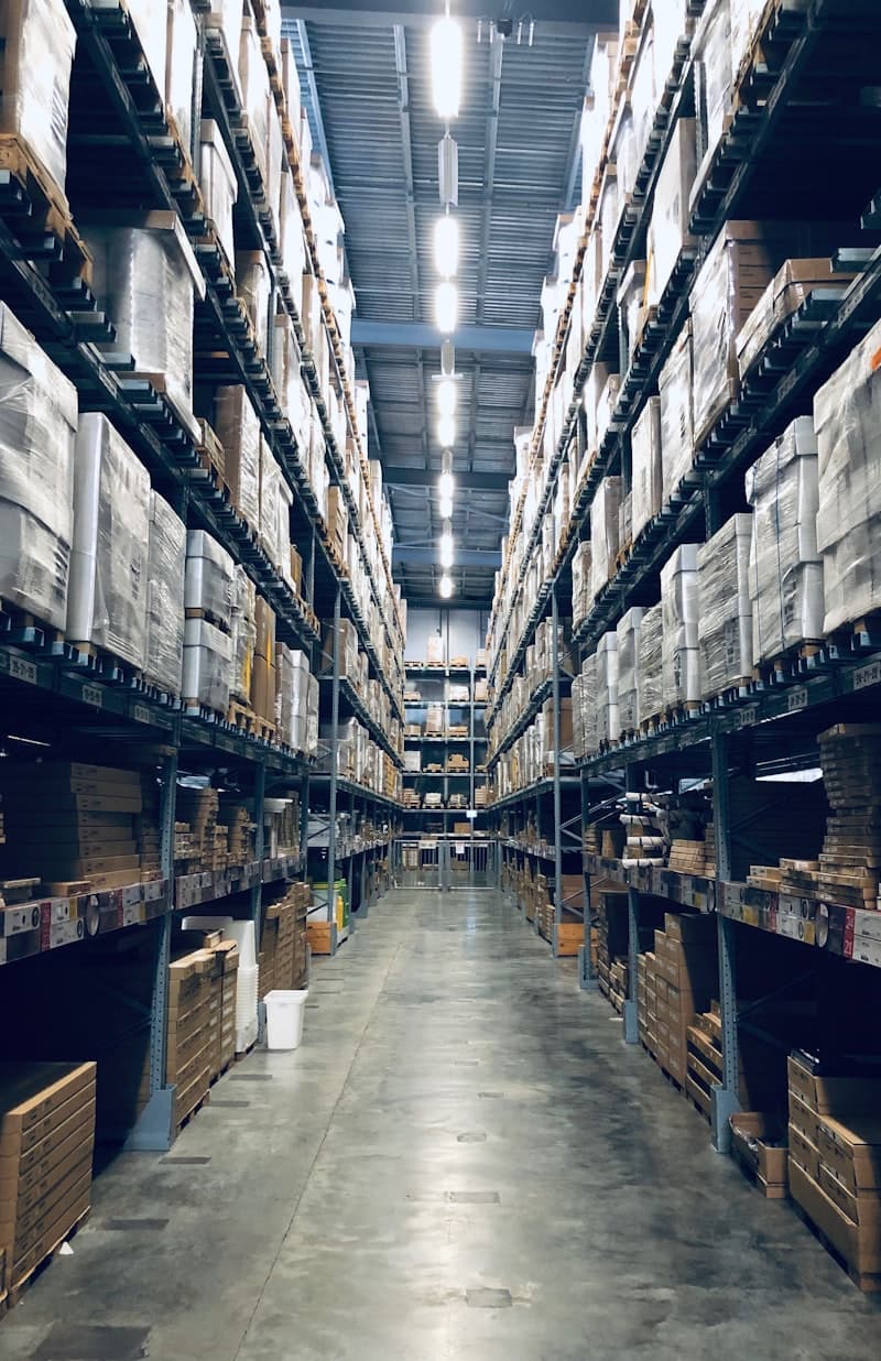 Tall warehouse racks stacked with goods