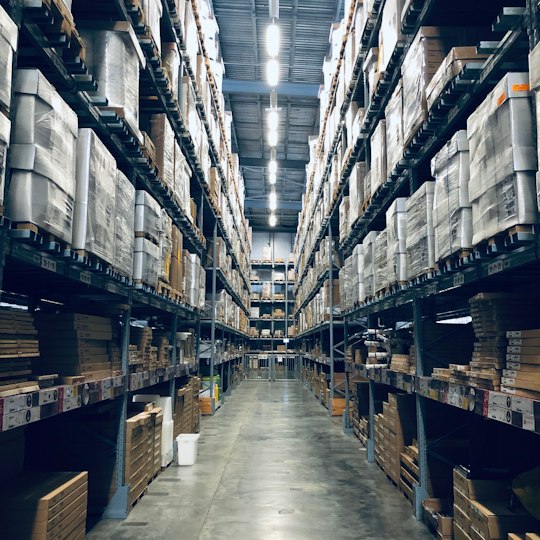 Fulfilment warehouse aisle stacked with inventory