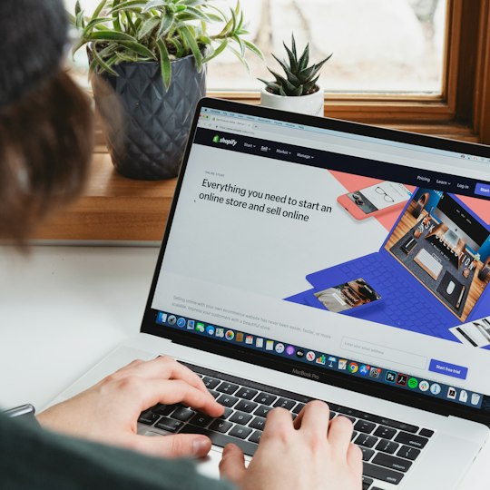 Online seller managing their store from a laptop