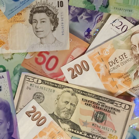 Banknotes in several currencies spread out