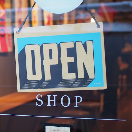 Open sign on a marketplace seller shop door