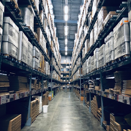 Tall warehouse racks stacked with goods